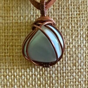 Copper pendant with Larimar stone on a leather cord